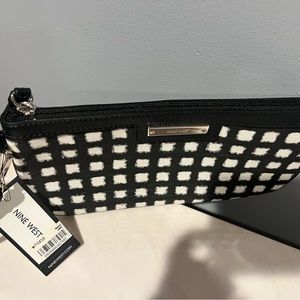 Black and white wristlet. Credit card slots.